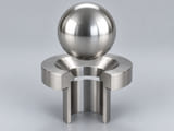 Conceptual CGI: Complete AISI 316 or low-carbon 316L austenitic stainless steel sphere above a conical annular seat and an aligned open vertical bore; axial component contact concept