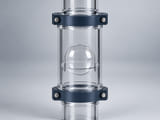 Conceptual CGI: Transparent observation chamber with a clear solid PMMA sphere retained by an annular support; conceptual fluid component