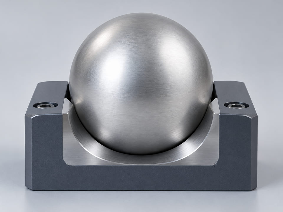 Conceptual CGI: low-inertia mechanical indexing assembly cutaway with one solid aluminium sphere gently retained against a dry precision locating groove; no liquid, no flotation