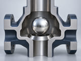 Conceptual CGI: A simple vertical check valve section: complete polished silver solid sphere positioned just above an annular conical seat with a single axial passage below, surrounding metal housing section clearly open to viewer, no through-hole in sphere