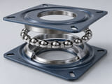 Conceptual CGI: furniture swivel bearing exploded view with a restrained dry interior race and steel spheres