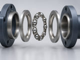 Conceptual CGI: Exploded light-duty ball bearing assembly showing two shallow circular race washers and a thin stamped metal ring retaining evenly spaced steel spheres, correctly coaxial assembly with restrained clear spacing