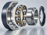 Conceptual CGI: precision deep-groove bearing exploded cutaway with polished chrome steel balls between inner and outer race