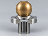 Conceptual CGI: Complete Specified copper-aluminium bronze alloy; exact grade and condition required sphere above a conical annular seat and an aligned open vertical bore; axial component contact concept
