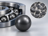 Conceptual CGI: dark-grey carbide sphere with a separate magnified abstract hard-grain and binder mosaic, clean diagrammatic CGI, clearly conceptual not microscopy